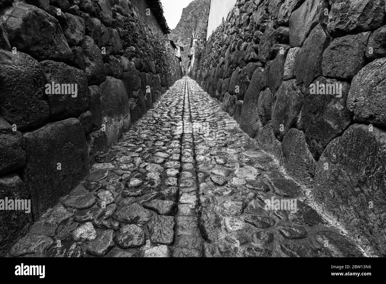 B&W of ancient Incan street in Ollantaytambo Peru and unchanged over