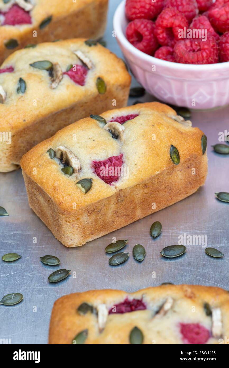 Homemade mini banana and raspberry loaf cakes Stock Photo