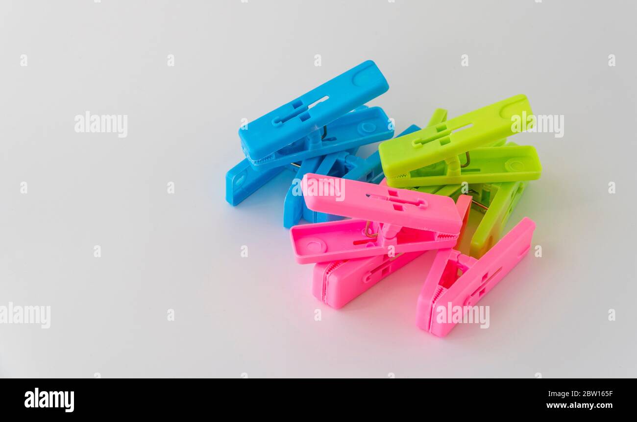 The multicolored clothespins on a white background Stock Photo Alamy
