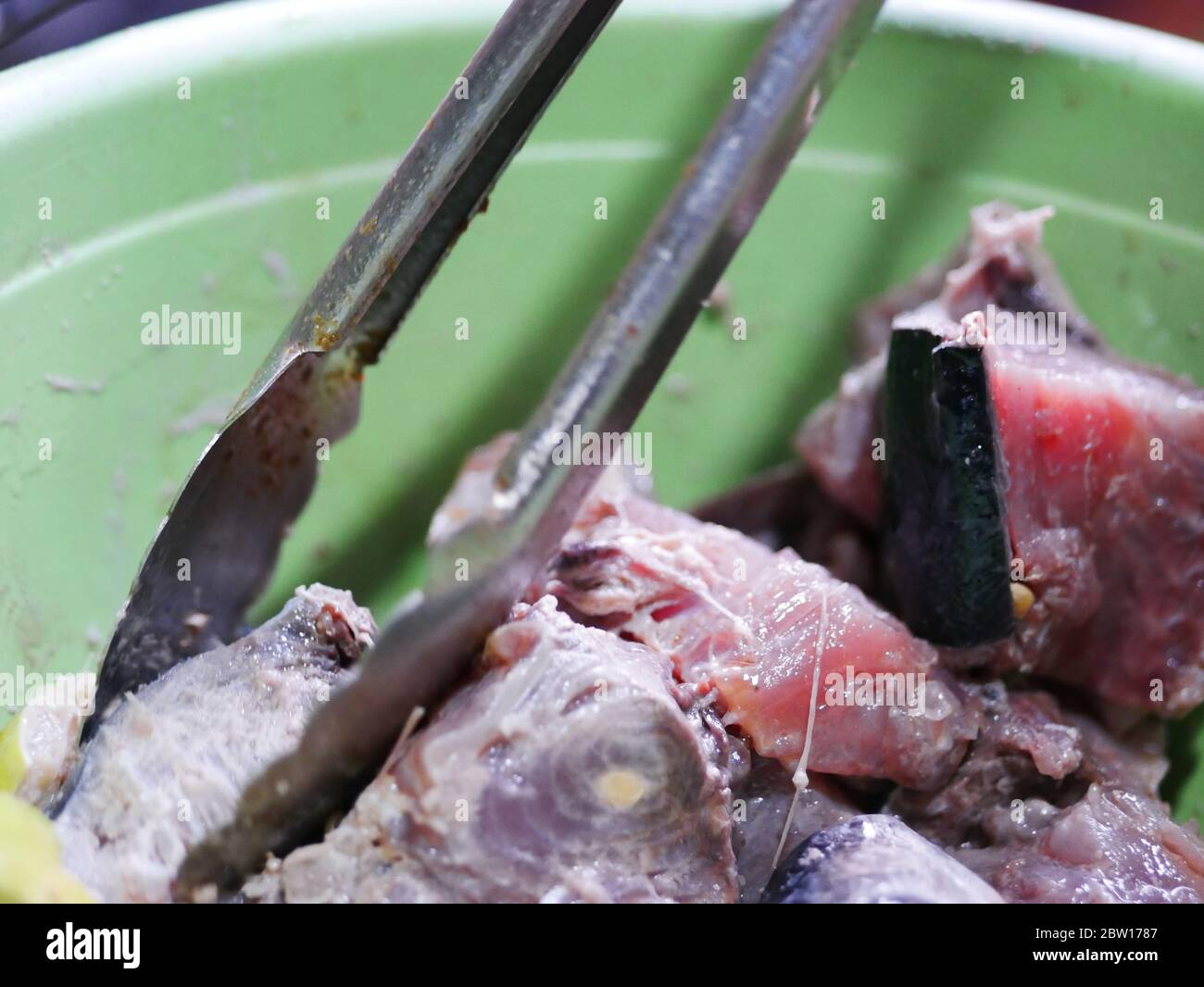 Fresh slice milkfish in plastic basket Stock Photo