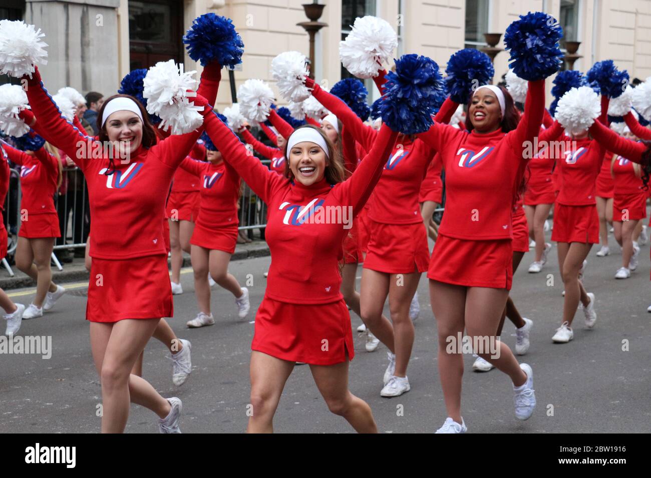 Cheerleaders in red outfits during the new years day parade. London Stock Photo