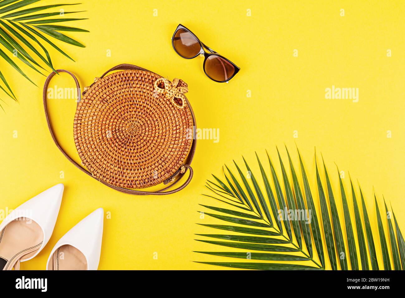 Download Summer Composition With Female Fashion Outfit Tropical Palm Leaves Straw Bag Shoes On Yellow Background Flat Lay Top View Overhead Mockup Stock Photo Alamy