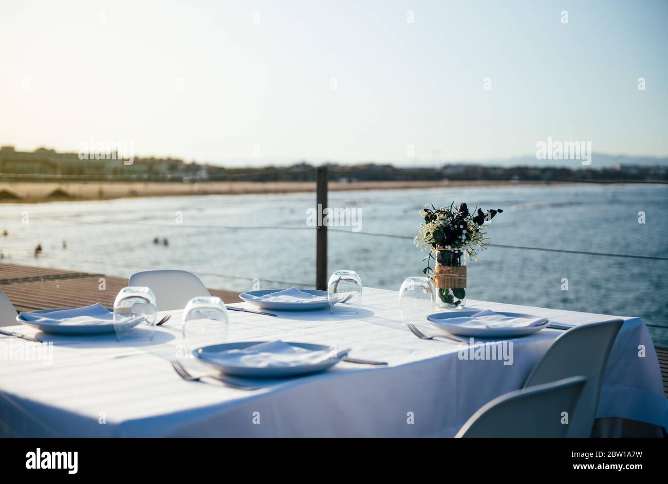 Restaurant Table With White Tablecloth On The Terrace By The Sea Concept Of Return To Normal During The Pandemic Stock Photo Alamy