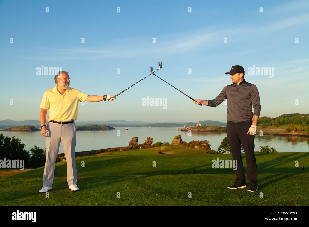 Aberdour, Fife, UK. 29th May, 2020. Andrew Hubble from Dalgety Bay and Marcus Kelman (30) from Dalgety Bay teeing off at 5.30am on the first day of restrictions being lifted in Scotland Credit: Richard Newton/Alamy Live News Stock Photo