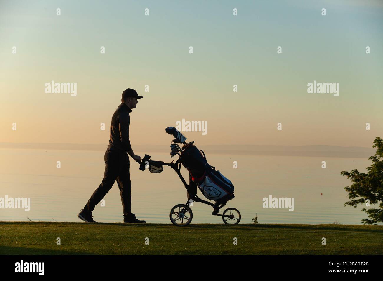 Aberdour, Fife, UK. 29th May, 2020. Marcus Kelman (30) from Dalgety Bay preparing to tee off at 5.30am on the first day of restrictions being lifted in Scotland Credit: Richard Newton/Alamy Live News Stock Photo