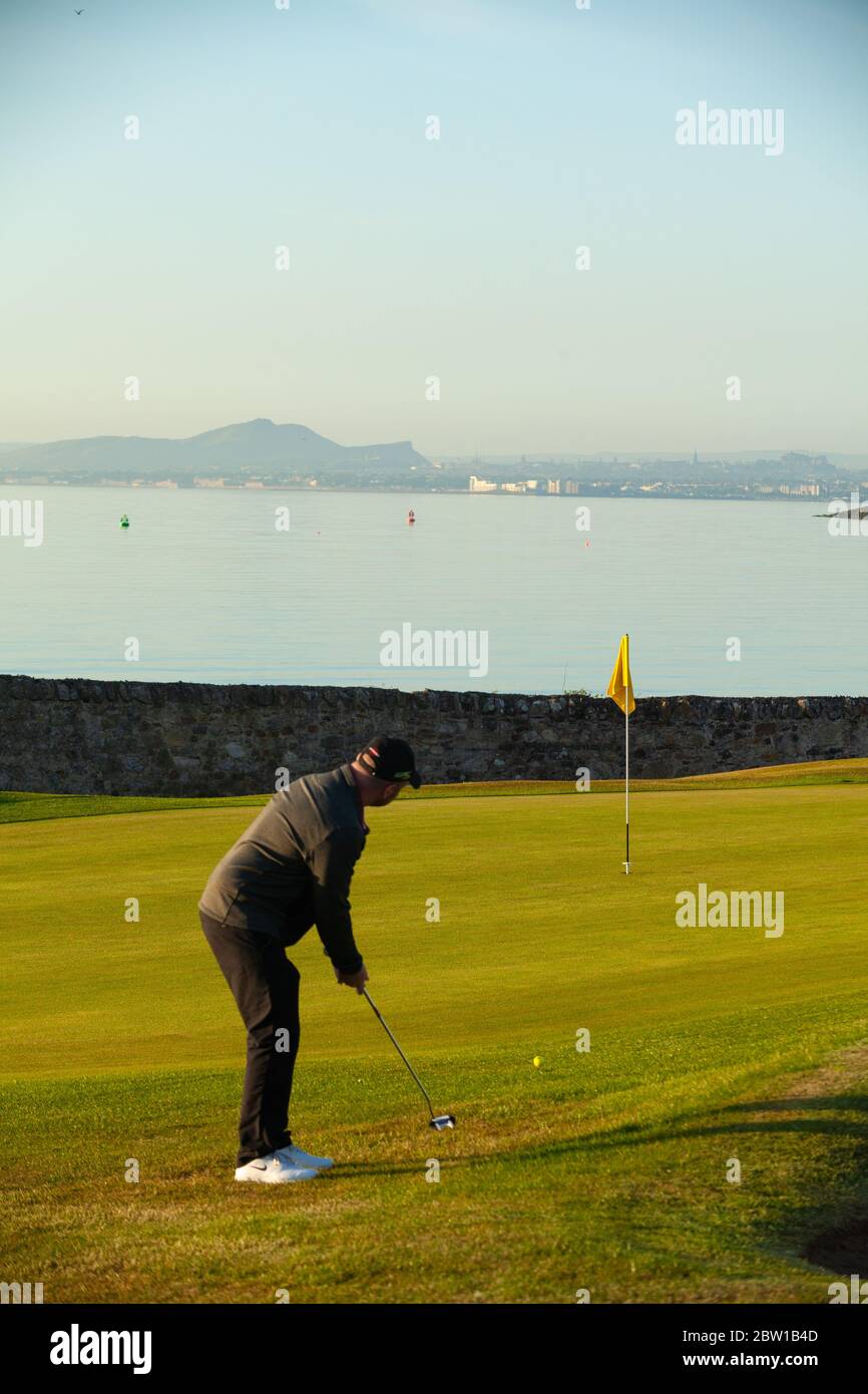 Aberdour, Fife, UK. 29th May, 2020. Alan Hamilton (32) from Dalgety Bay at the first green on the first day of restrictions being lifted in Scotland Credit: Richard Newton/Alamy Live News Stock Photo