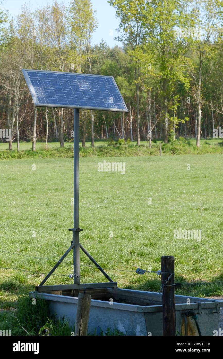 livestock water tank, which uses solar panels to pump the water out of