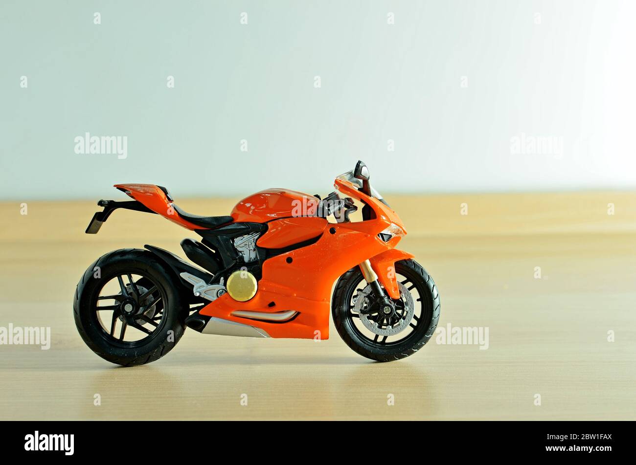 Orange motorcycle toy with background Stock Photo