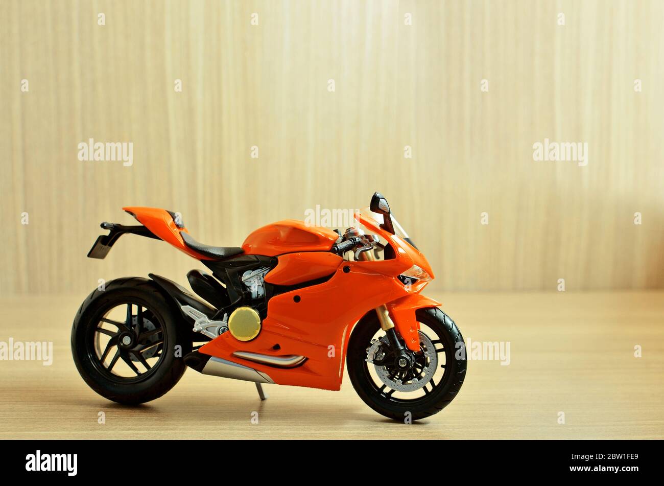 Orange motorcycle toy with background Stock Photo