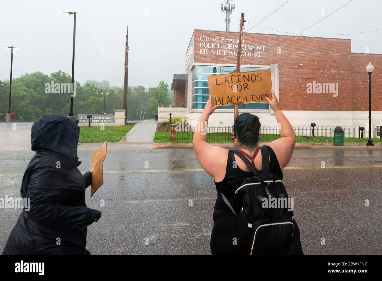 Ferguson, Missouri, USA. 28th May, 2020. People gather outside the Ferguson Police Department to protest the Minneapolis Police killing of George Floyd. Credit: James Cooper/ZUMA Wire/Alamy Live News Stock Photo