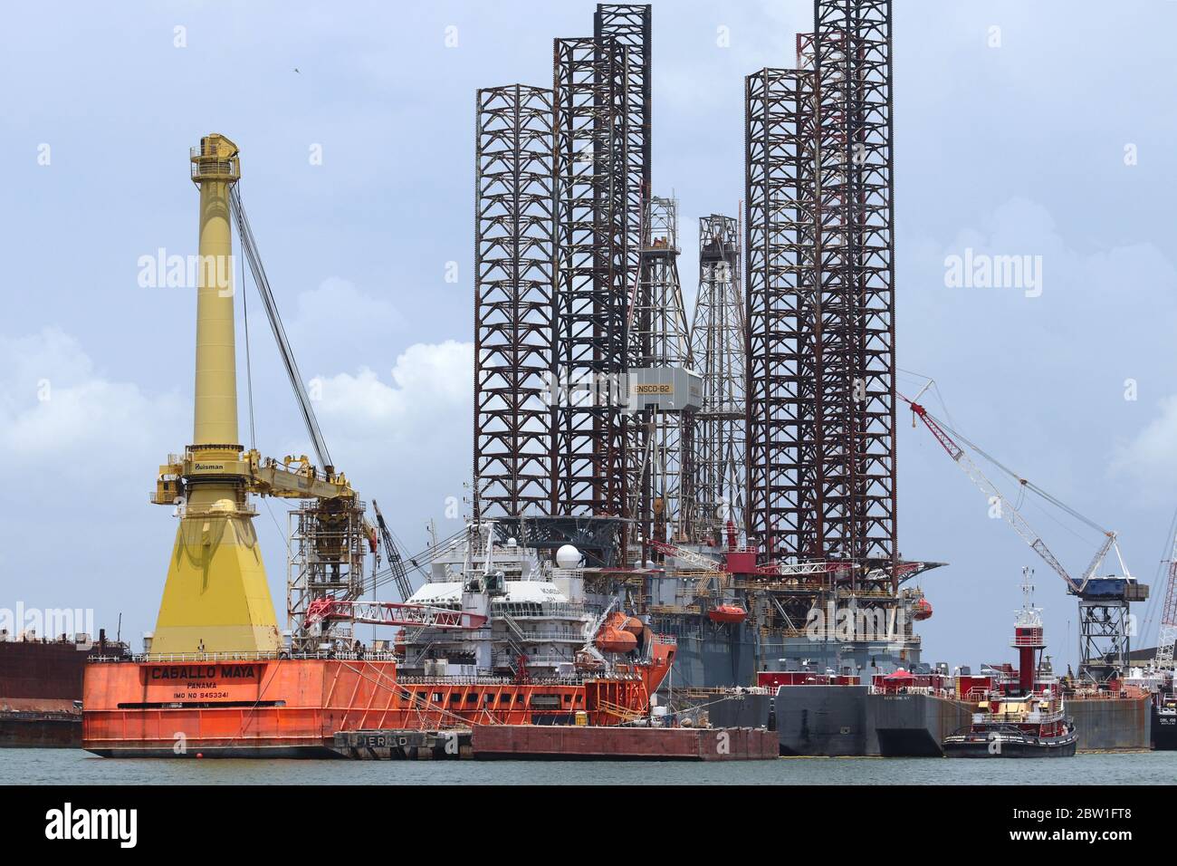 Docked oil platform, offshore drilling rig, in Port of Galveston, Texas, USA. The oil rig is getting rehabbed in the Texan harbor on the Gulf Coast. Stock Photo