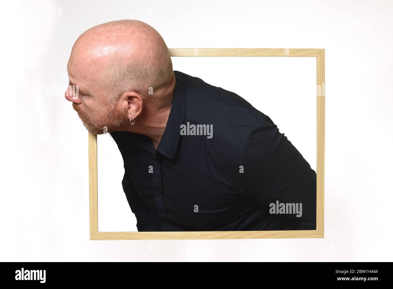 man looking from inside a box Stock Photo - Alamy