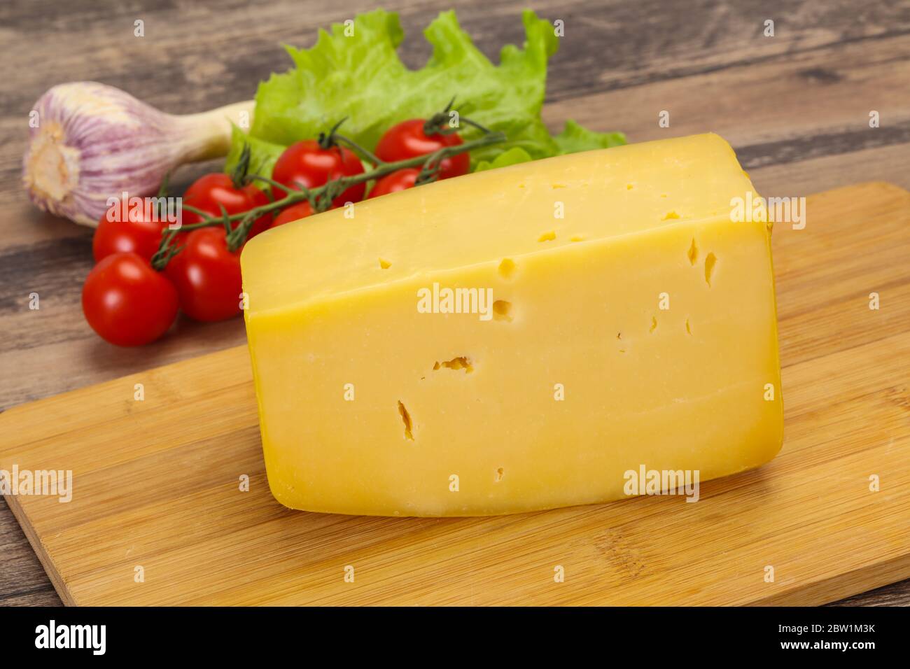 Swiss Hard yellow tasty cheese brick Stock Photo Alamy
