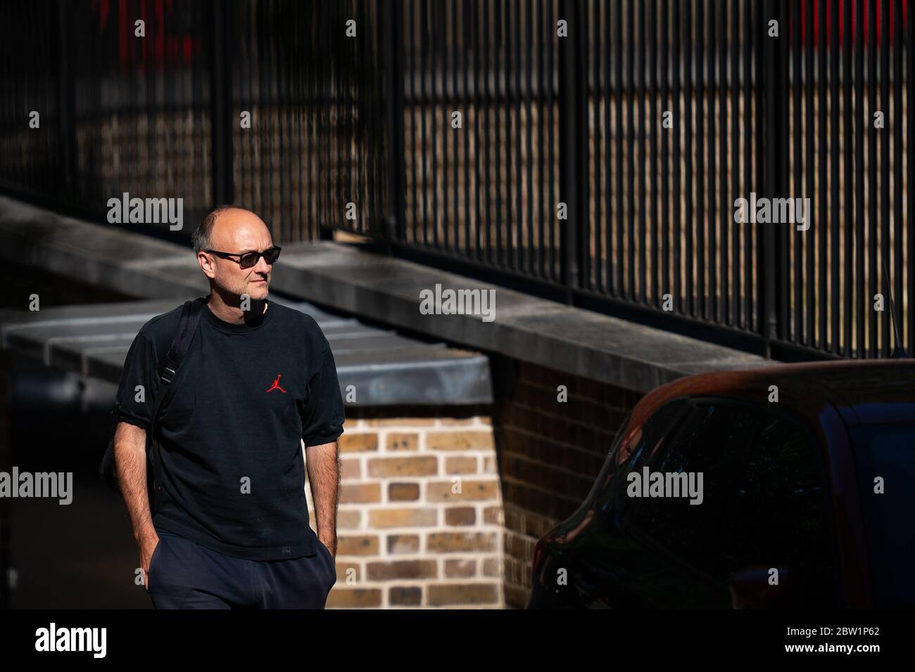 Dominic Cummings top aide to Prime Minister Boris Johnson arrives at the back of Downing Street after the introduction of measures to bring the country out of lockdown. Stock Photo