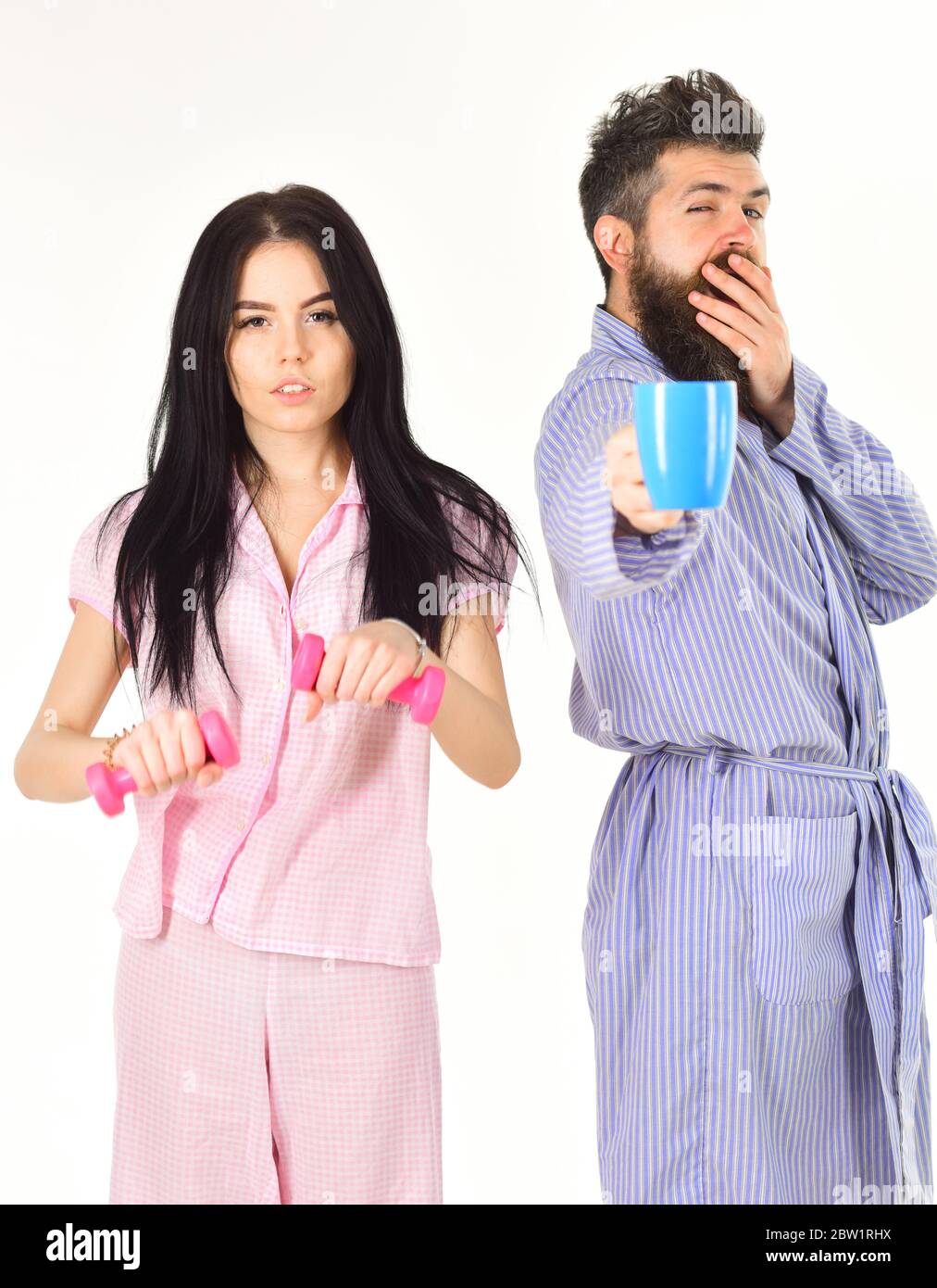 Couple in love in pajama, bathrobe stand isolated on white background