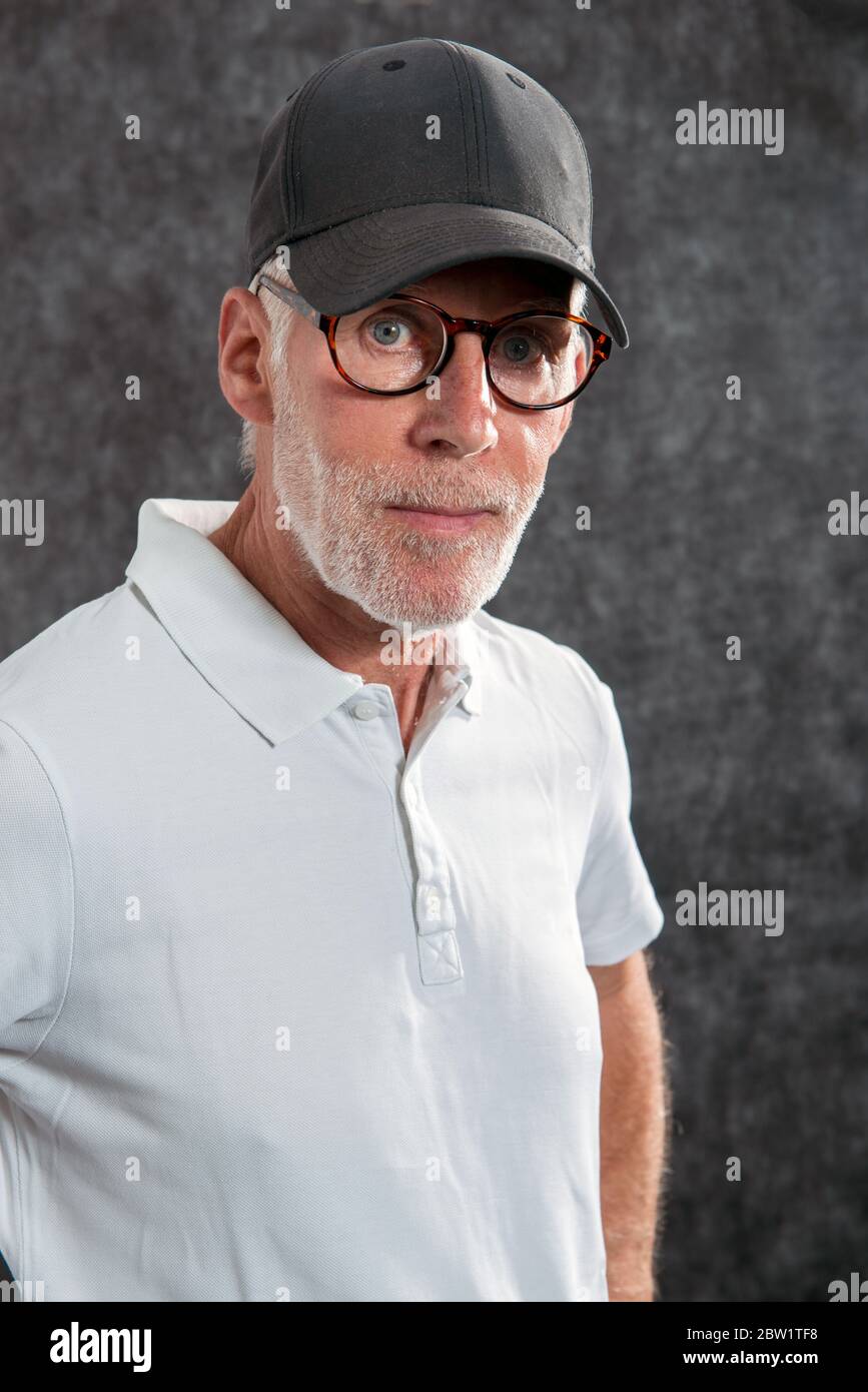Older man wearing baseball cap hires stock photography and images Alamy