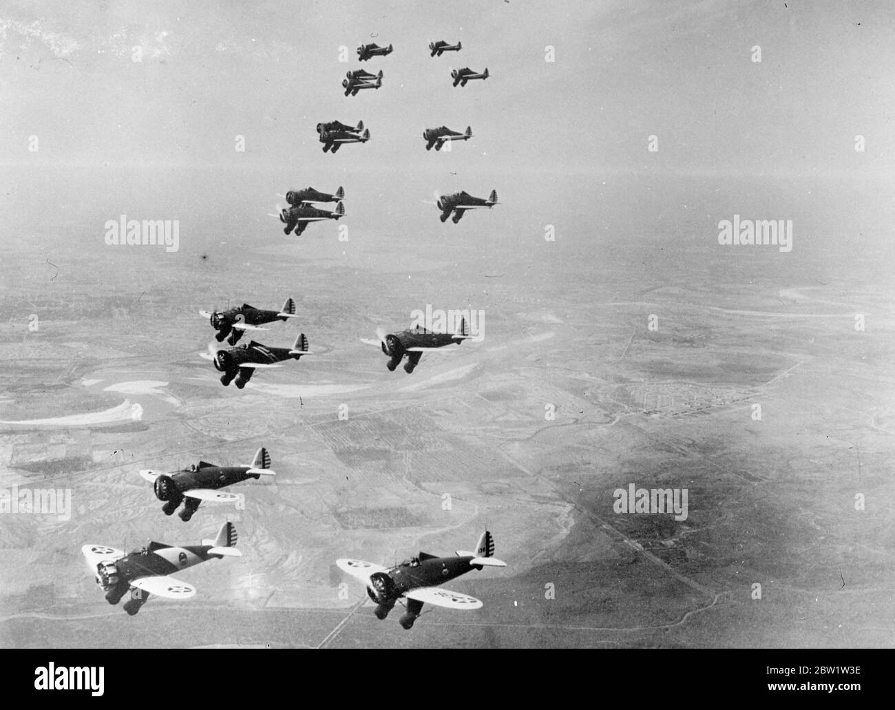 Man-made Hornets leave nest to sting. Photo shows: Hornets like Boeing pursuit planes of the United States Army Air Corps flying in formation over the West Coast where they were to take part in the general manoeuvres of the American forces. This planes are the latest American combat machines. 19 April 1937 Stock Photo