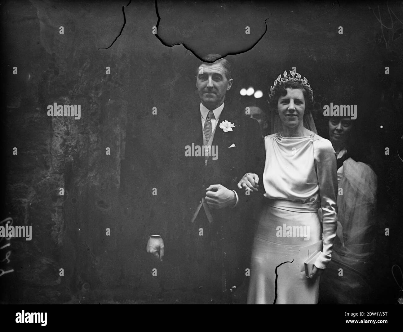 Jutland hero married in London . Captain Cyril Eustace Douglas Pennant , who was in command of HMS Iron Duke , was married at the St Ethelburga ' s church , Bishopsgate , to Miss Sheila Brotherhood , second daughter of Mr and Mrs Stanley Brotherhood of Thernhaugh Hall , North Northamptonshire , and a well known rider tohounds . The bridegroom , who won the DSC , for gallantry at Jutland , is a nephew of the Speaker of the House of Commons . His first marriage was dissolved last June . Photo shows , the bride and bridegroom after the ceremony . 5 April 1937 Stock Photo