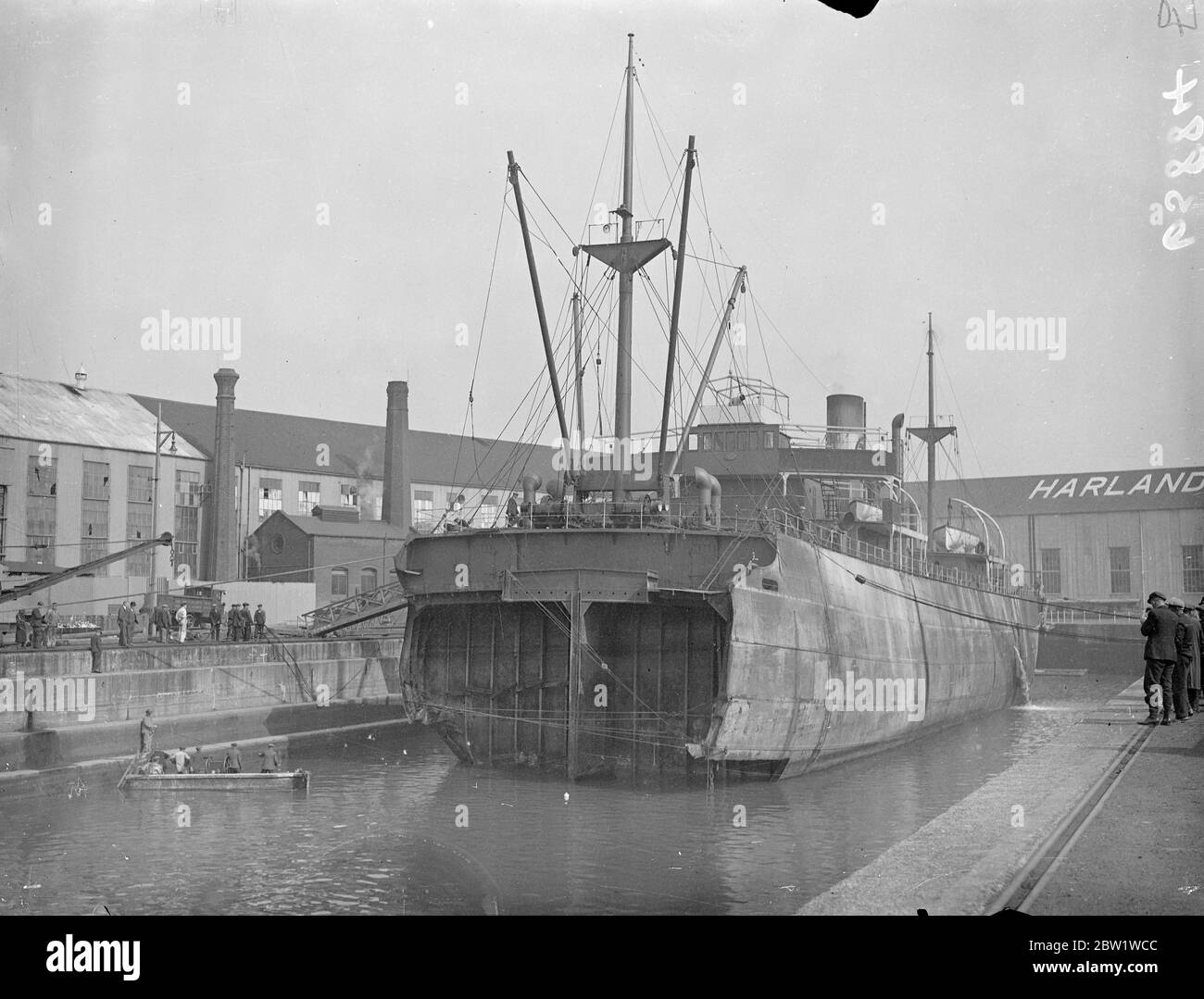 Half-a-ship in dock. English Trader waits for her new bow. Broken in half when she went aground recently in a gale, the steamer English Trader has been towed into dock at Southampton for inspection and will be fitted with a new bow. Photo shows: the English Trader waiting for the grafting of her new bow in dock at Southampton. 28 April 1937 Stock Photo
