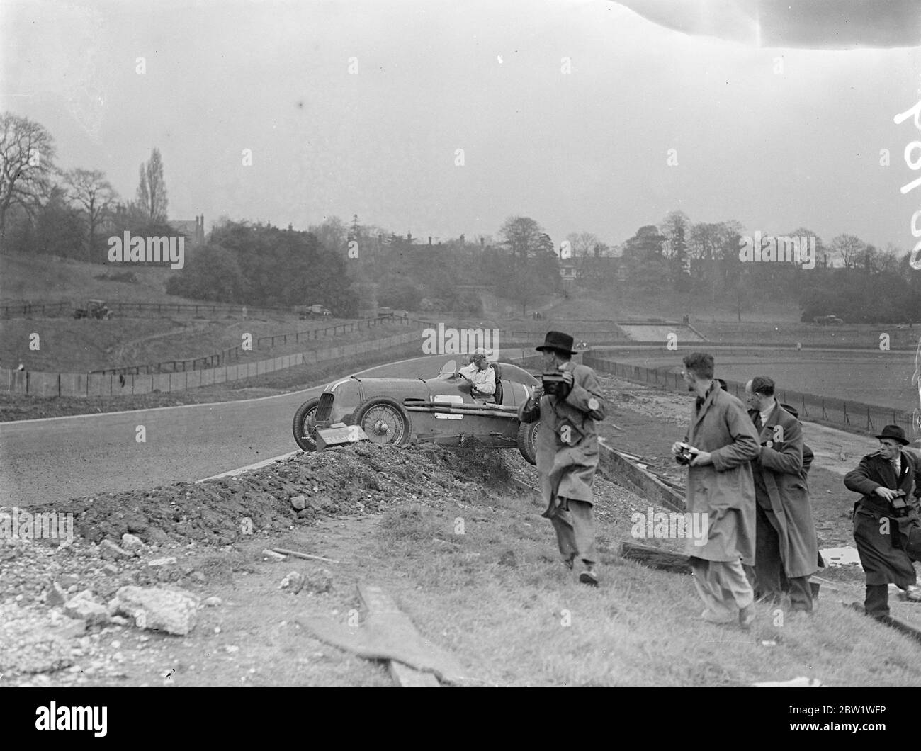 Appleton goes 'over the top' at new Crystal Palace track. Two mishaps marked the first practice by racing drivers after the opening by Earl Howe of the new road racing circuit at the Crystal Palace. Page H J W Appleton went 'over the top' at Stadium corner and Raymond Mays ran off the track owing to a wheel locking at the same point. Photo shows, page H J W Appleton going over the top of the banking at Stadium corner. 22 April 1937 Stock Photo