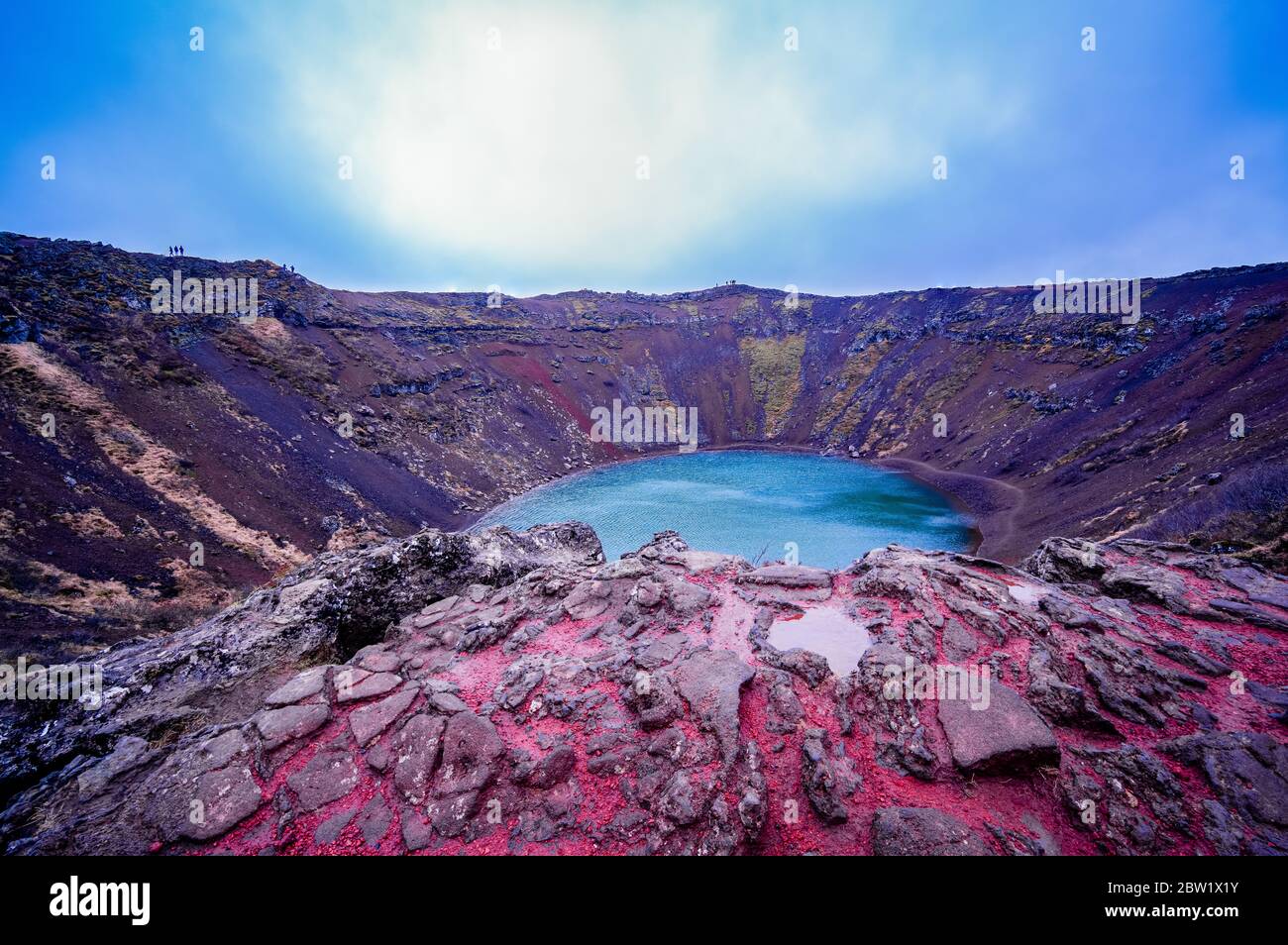 View over the water filled volcanic crater Kerið in Iceland, with ...