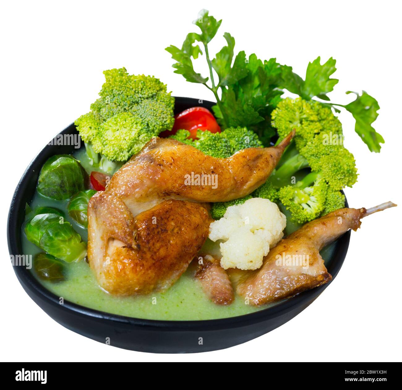 Cream soup boiled with quail, served with broccoli, brussels sprouts