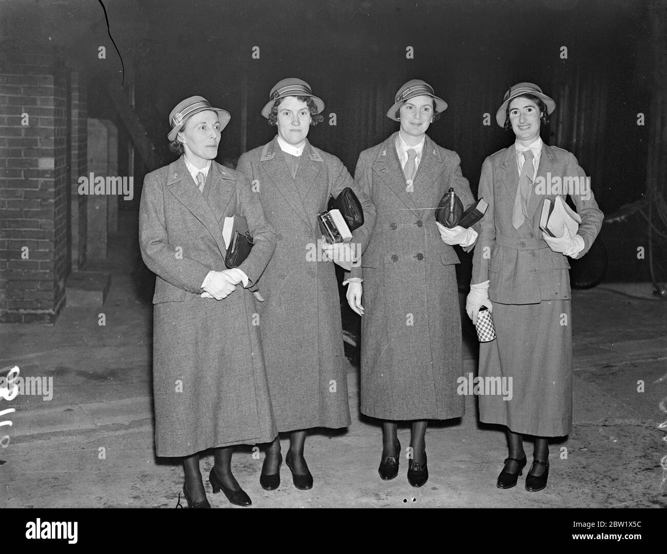 British nurses leave in RAF flying boats to turn wounded German sailors at Gibraltar. For British voluntary aid department nurses took off from Calshot, Southampton Water, into Royal Air Force flying boats for Gibraltar to attend German sailors wounded when the 'Deutschland's' was bombed. The nurses are M R Ikin of Aldershot, Sister G E Morgan Tidworth, Sister N K Smyth , of Millbank, London, and Sister M Ellis of the Royal Victoria Military Hospital, Netley. This is the first time in the history of the military embarkation at Southampton that any passengers had been embarked for service by ai Stock Photo