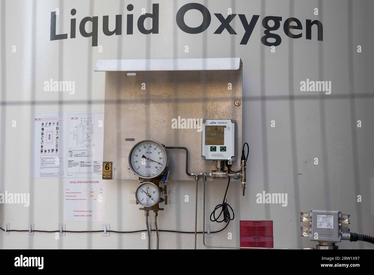 Pressure dials and gauges on a liquid oxygen cylinder at University Hospital of Wales in Cardiff, May 2020. Stock Photo