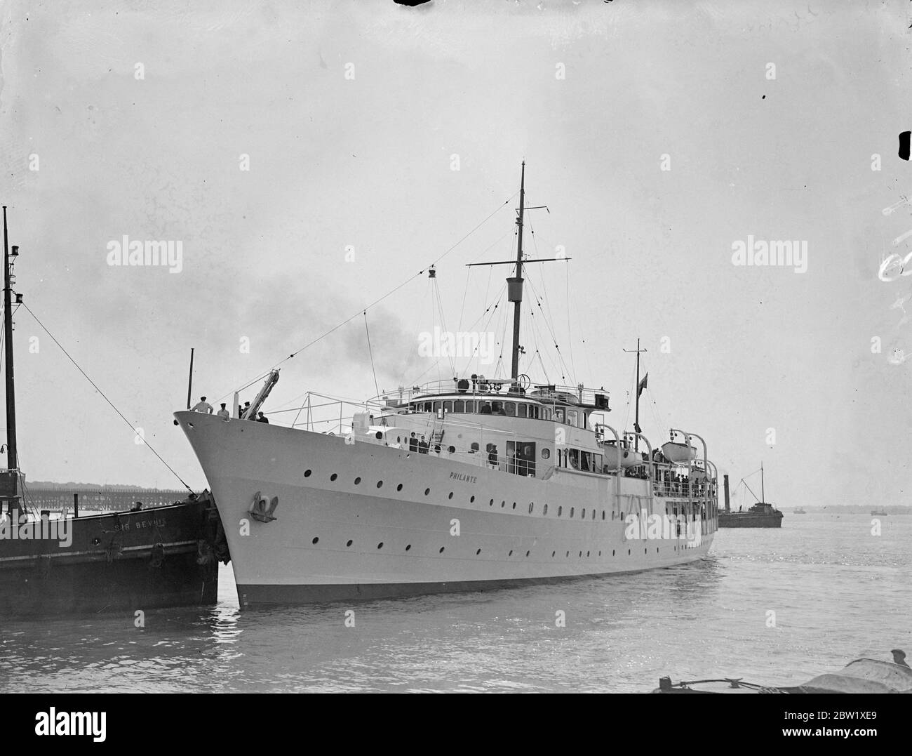 T. O. M. Sopwith embarks on the new luxury yacht for trials. With Mr T. O. M. Sopwith, the owner, and his wife aboard, the new luxury yacht Philante left Southampton for her trials. Philante will later cross the Atlantic to tender Mr Sopwith's racing yacht Endeavour II, which Is Expected to challenge for the America's Cup. Photo Shows: the Philante leaving Southampton for her trials. 25 May 1937 Stock Photo