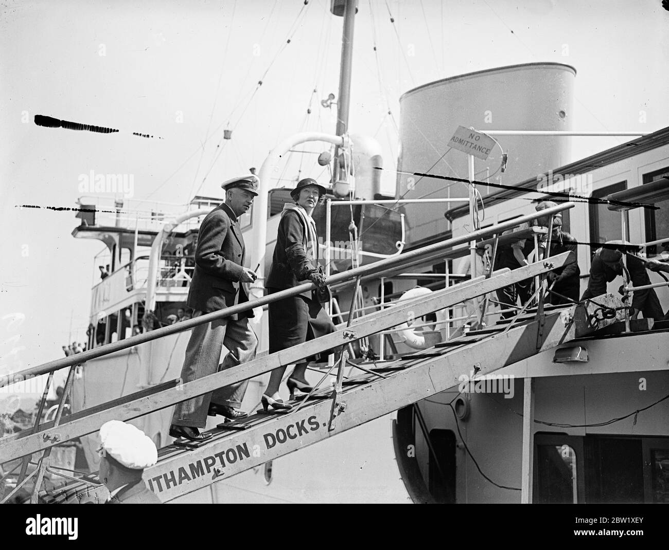 T. O. M. Sopwith embarks on the new luxury yacht for trials. With Mr T. O. M. Sopwith, the owner, and his wife aboard, the new luxury yacht Philante left Southampton for her trials. Philante will later cross the Atlantic to tender Mr Sopwith's racing yacht Endeavour II, which Is Expected to challenge for the America's Cup. Photo Shows: Mr T. O. M. Sopwith and his wife going aboard Philante at Southampton before she left on trials. 25 May 1937 Stock Photo