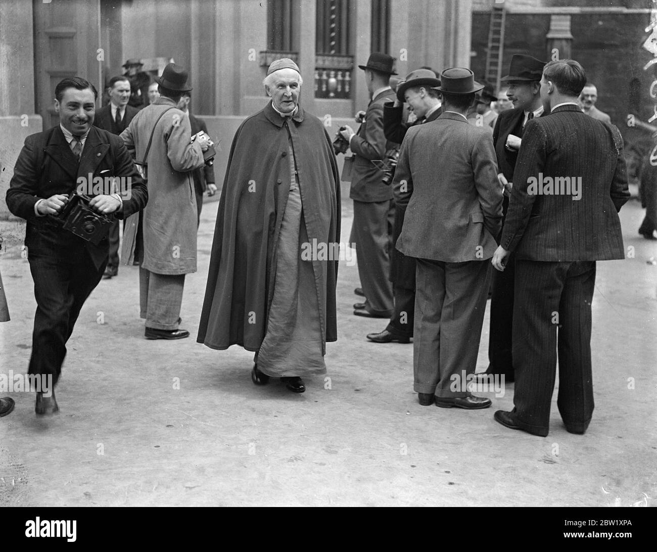 Archbishop of Canterbury leaves after final Coronation rehearsal. Photo shows: Archbishop of Canterbury, Dr Cosmo Gordon Lang, leaving in his robes after attending the final rehearsal of the Coronation ceremony in Westminster Abbey. Dr Lang will conduct the Coronation service and will place the Crown on the King's head. 10 May 1937 Stock Photo