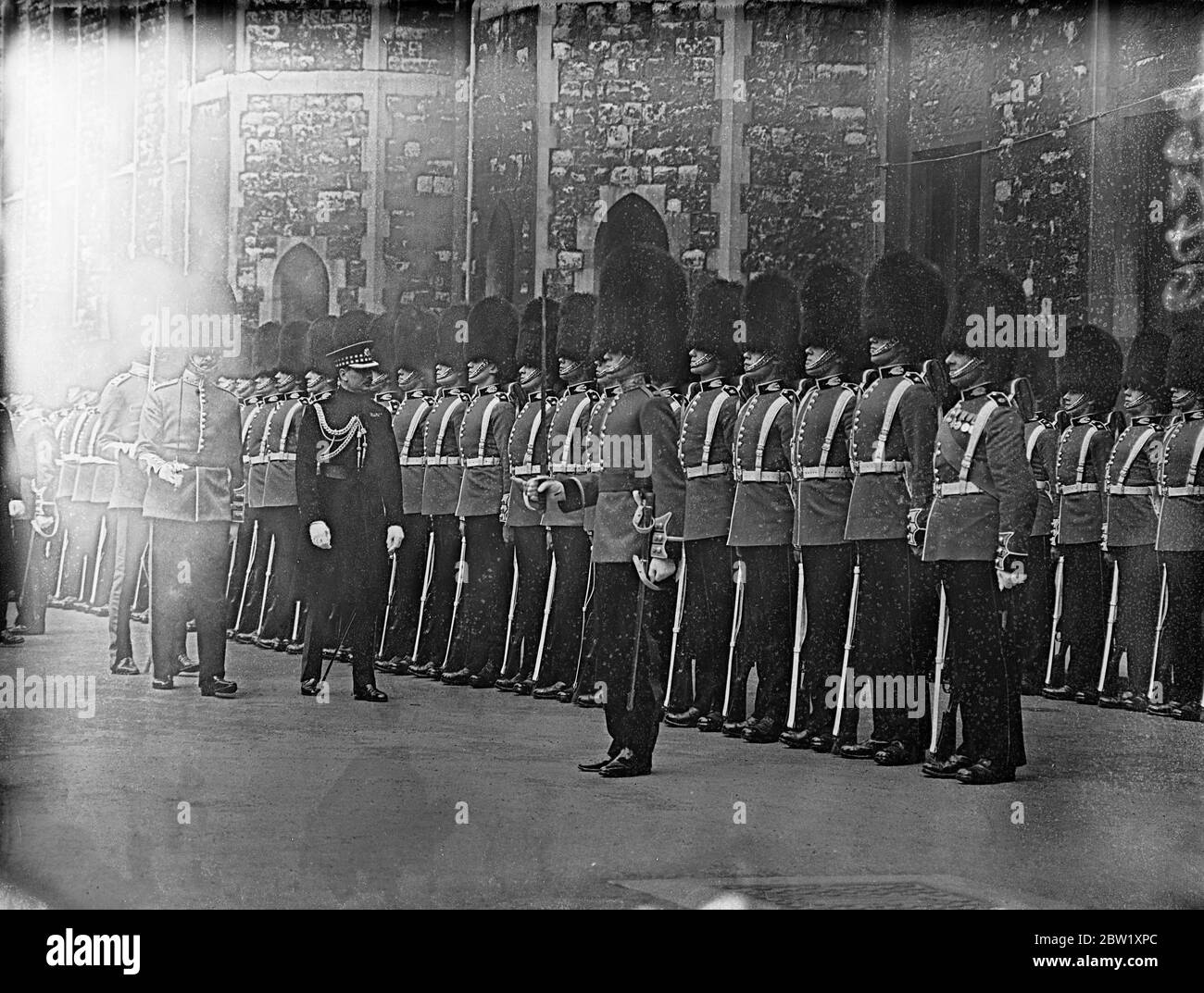 Coldstream Guards at the trooping of the colour. Coldstream Guards standing to attention for the trooping the colour ceremony, to take place, at Horse Guards Parade. Photo shows, Coldstream Guards standing to attention. 6 May 1937 Stock Photo