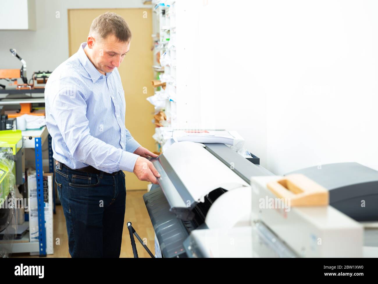 Plotter printing wide format large banner hi-res stock photography and ...