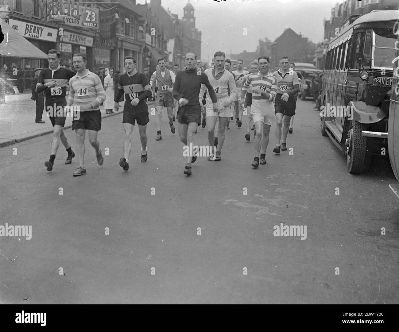 Police compete in Barking - Southend Walk. Police athletes started from Barking Police Station on their annual Barking - Southend. Photo shows: competitors on the road. 29 April 1937 Stock Photo