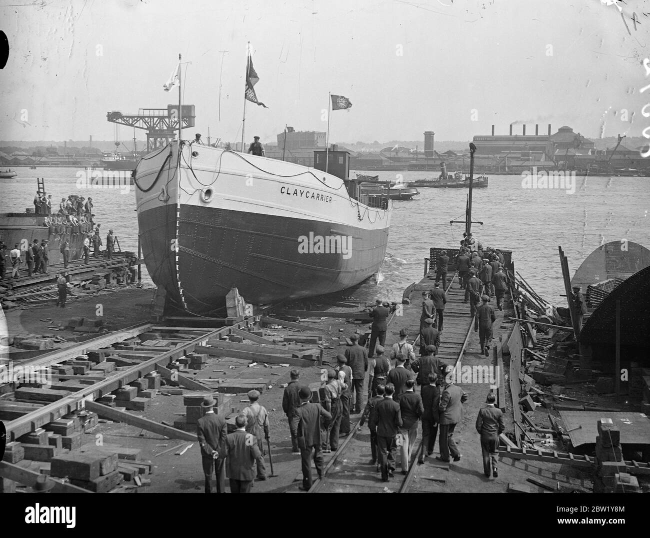 Launch of Thames side's biggest vessel for 25 years. The motor vessel clay carrier', believed to be the largest vessel to be built on the Thames side since HMS Thunder was launched nearly 25 years ago, was launched at the North Woolwich, yards of Harland and Wolff, limited. The ceremony was performed by Mrs James E Hird, wife of the manager of Associated Portland Cement Manufacturers, Limited. Join lighterage department, for whom the 'Claycarrier' was built. The Claycarrier is a tanker vessel capable of carrying about 1000 tons of slurry (a mixture of clay and water). She is powered by four-cy Stock Photo