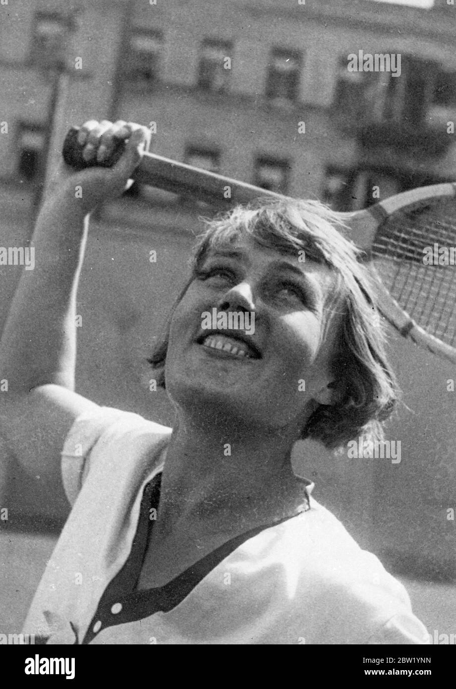 Russian sports girl plays tennis. Typifying the Russian version of the modern 'sports girl' 20 June 1937 Stock Photo