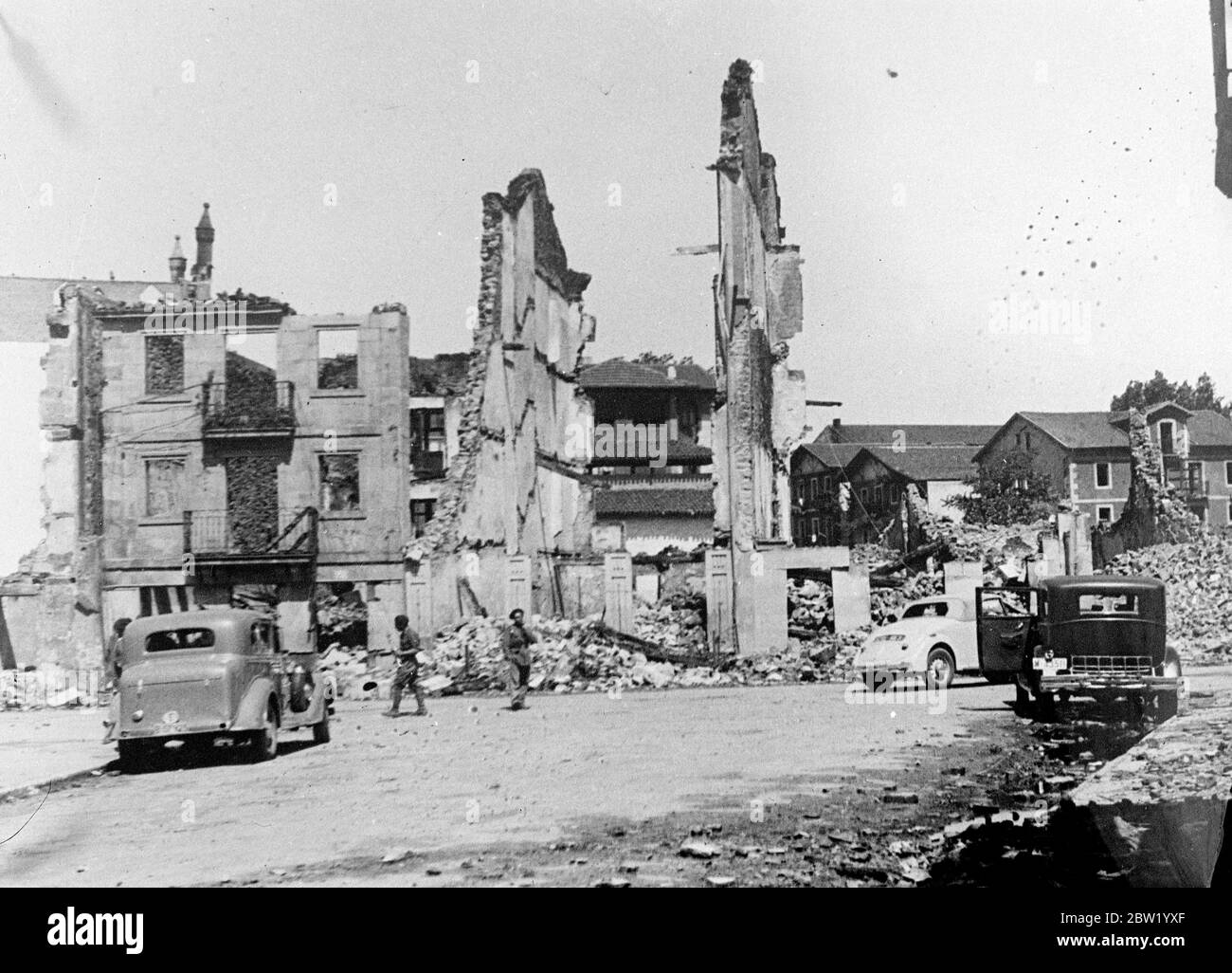 Bilbao buildings tumble before Franco's guns. First picture from besieged town. Much of Bilbao is in ruins following intense air and artillery bombardment with which the rebel forces have accompanied the great advance which has now taken them to the suburbs of the Basque capital. Artillery which was used by the rebels to smash the iron belt of Basque defence is now only two miles from Bilbao, and can pour shells on the remnants of the defence force in the heart of the town. Photo shows: buildings in Bilbao with only walls left standing after the terrific hammering given the town by the rebel g Stock Photo