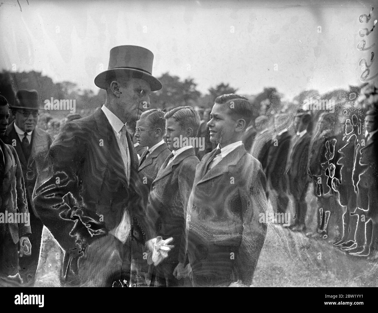 Admiral the Earl of Cork and Orrery inspected boys at the Bisley School, near Woking, at their Empire Parade. The boys carried standards of the dominions and colonies. 18 June 1937 Stock Photo