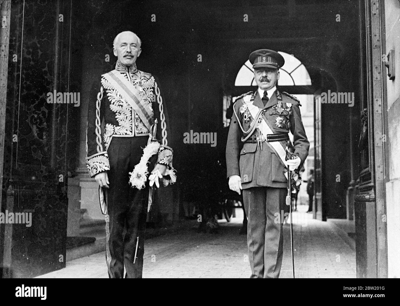 Sir Robert Clive, new British Ambassador (left), leaving with general Dubois after presenting his credentials to King Leopold at the Royal Palace in Brussels. 14 July 1937 Stock Photo