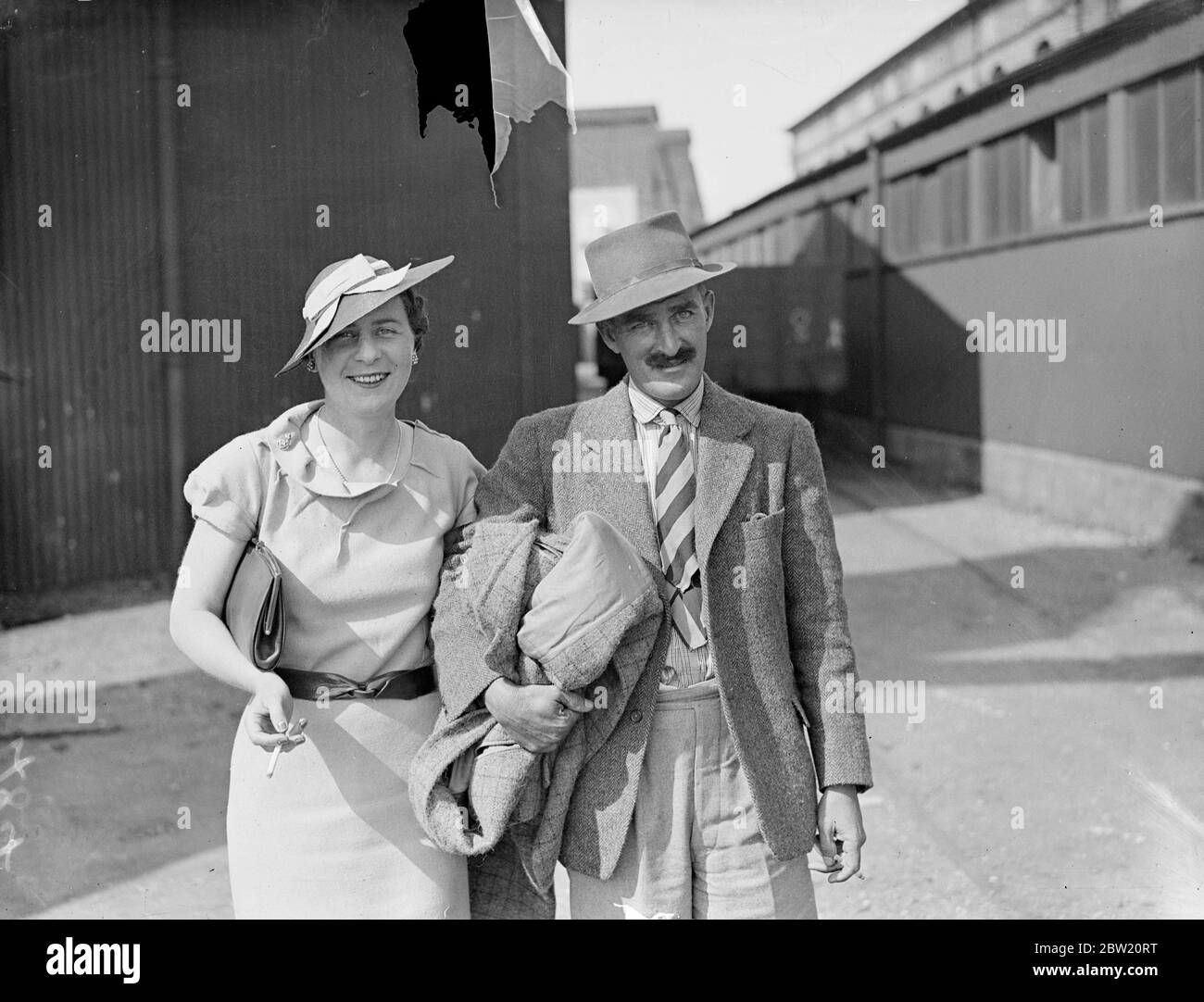 Captain Gimson of the Guides Cavalry, arrived at the southampton port by flying boat from India. Where he led a party of tochi scouts on a night raid to capture a mountain position held by tribesmen. He was met on arrival by his wife. 14 July 1937. Stock Photo