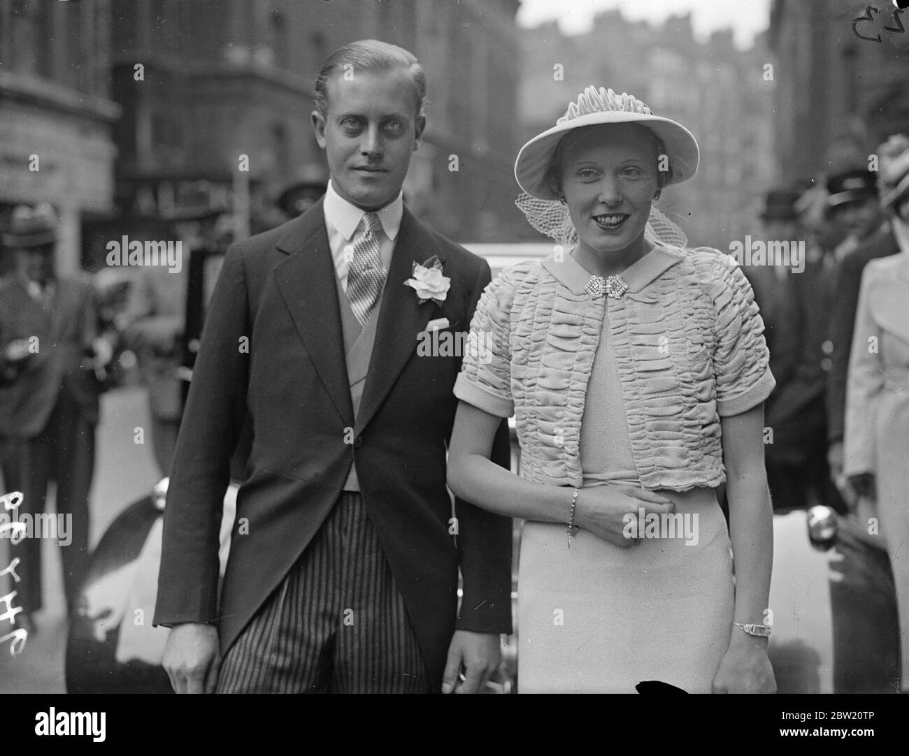 Earl of Normanton weds, daughter of Baroness Zouche at London Register Office. The Earl of Normanton was married to 31-year-old Mrs Palmer, daughter of Baroness Zouche, at Caxton Hall register office, London. The Earl is 27. The civil ceremony was followed by a religious ceremony at St Ethelburga's Bishopsgate. Photo shows, the bride and bridegroom leaving the Caxton Hall after their wedding. 5 July 1937 Stock Photo