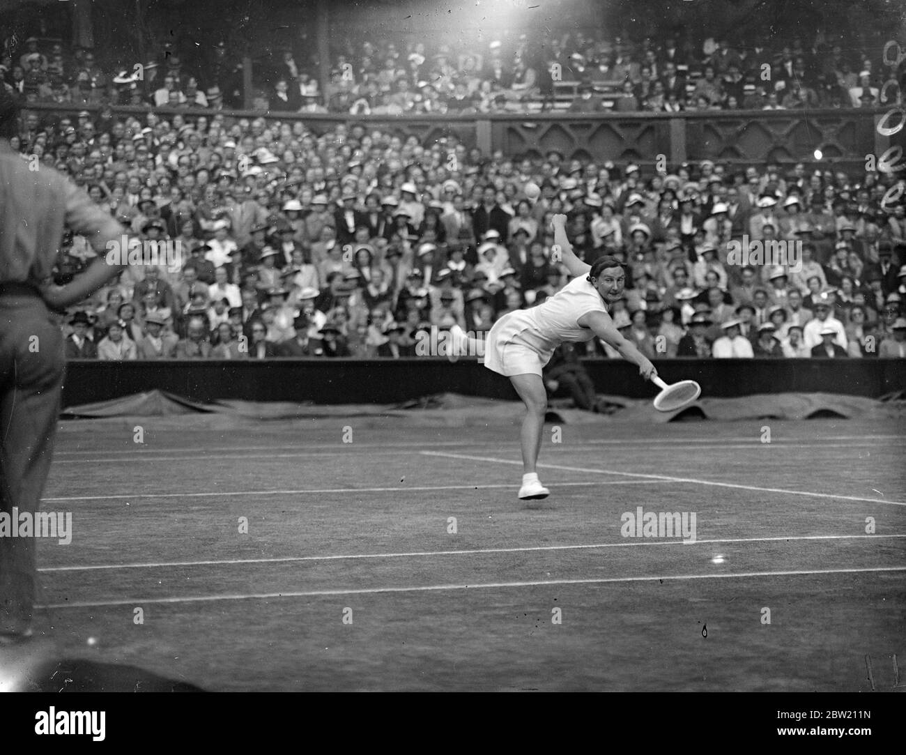Miss Dorothy Round of Great Britain, defeated Miss Helen Jacobs, the champion, 6-4, 6-2 in the women's singles at Wimbledon. Miss Dorothy Round in play against Miss Helen Jacobs on the Centre Court. 29 June 1937 Stock Photo