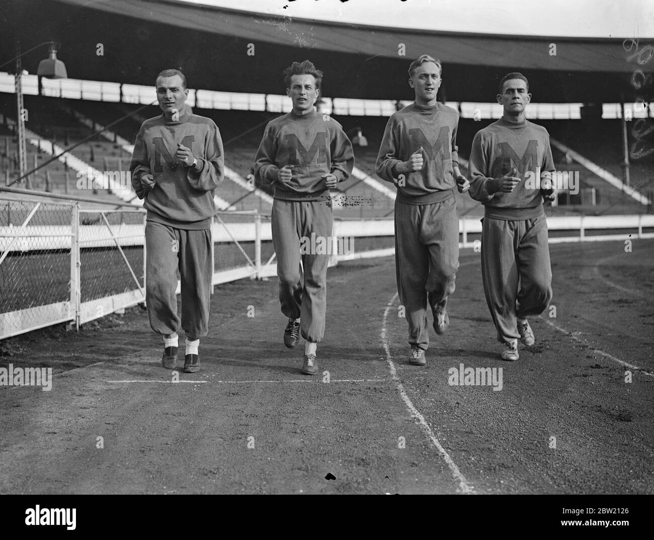 Members of the Hungarian team running round the White city track to take part in the amateur athletic championship. 15 July 1937. Stock Photo