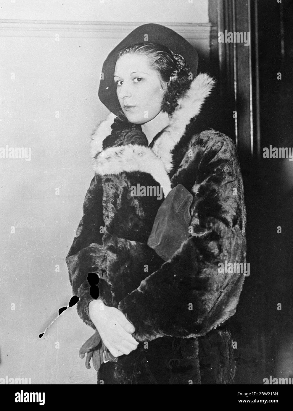 Norma Parker, 21-year-old gun girl of Broadway, is at large with three girl companions, all under 20, after a daring escape from the State prison farm at Bedford, New York. Led by Parker, the fugitive is apparently scaled a 7 foot barbed wire fence and managed to elude the guards. Parker, whose real name is Nellie Gutowski, was sentenced to an indefinite term of imprisonment after a series of hold-ups in which she robbed Broadway restaurant cashiers at the point of a dummy revolver. 30 June 1937 Stock Photo