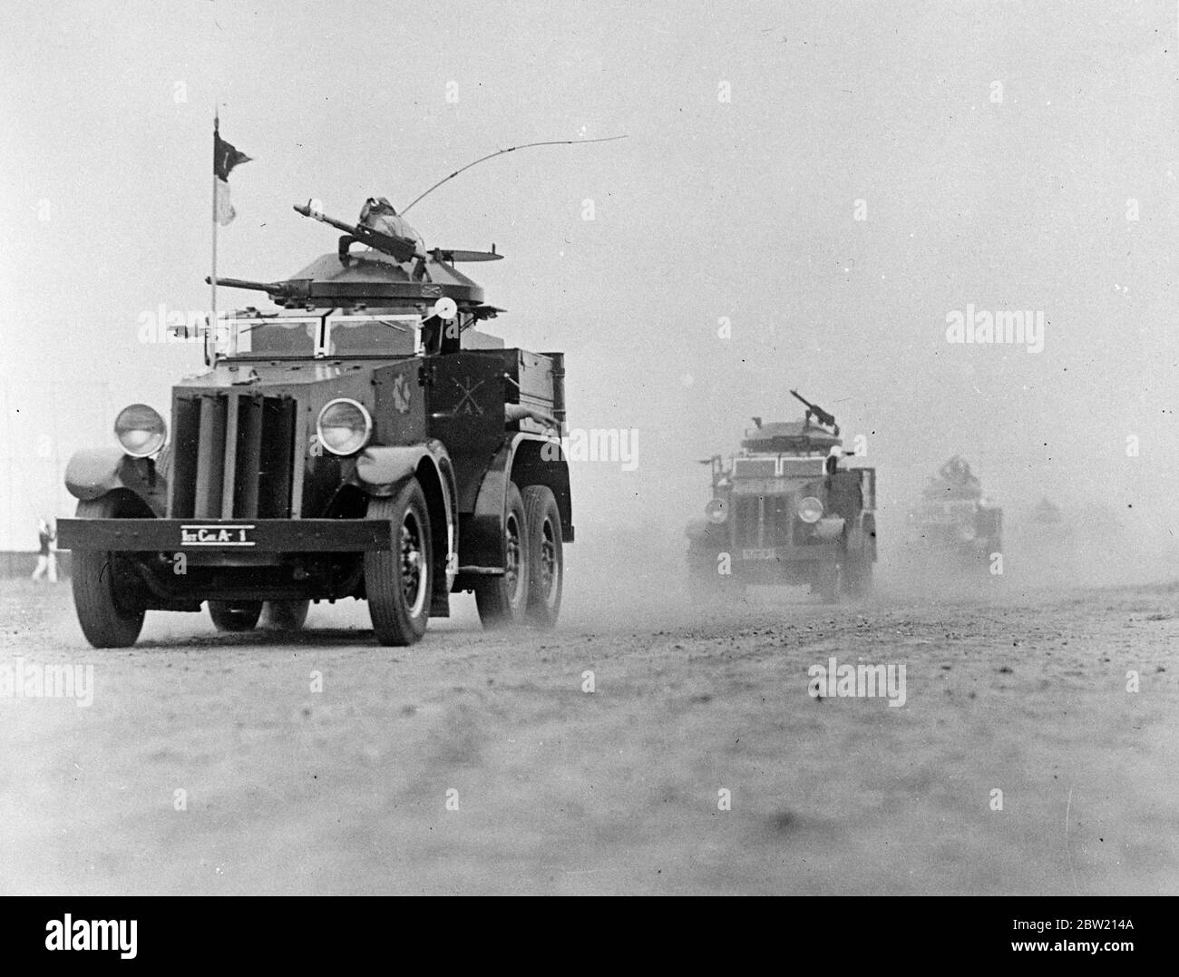 New armoured cars rumbling down the field as they took part in an exercises. Some of America's latest war machines took part in exercises celebrating tercentenary of Governor's Island, US Army base in New York Bay 1 July 1937 Stock Photo