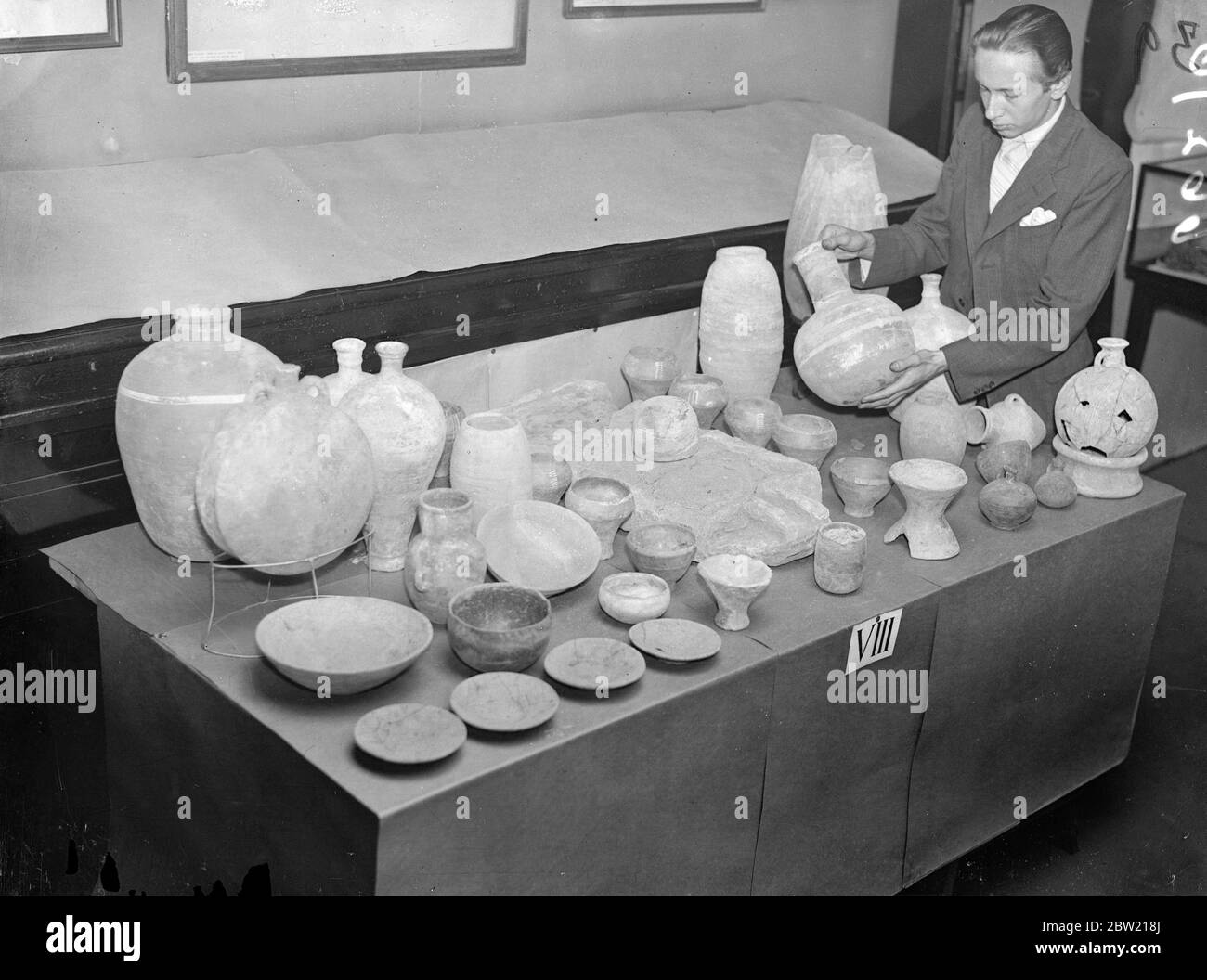 The ancient Egyptian pottery on view amongst other interesting exhibits at an exhibition of recent discoveries by the Egypt exploration Society held at Hinton Street Manchester Square. The discoveries were made 700 miles from the River Nile's mouth. Also found was a granite portrait head of the Egyptian princess who found Moses in the basket. 6 July 1937. Stock Photo