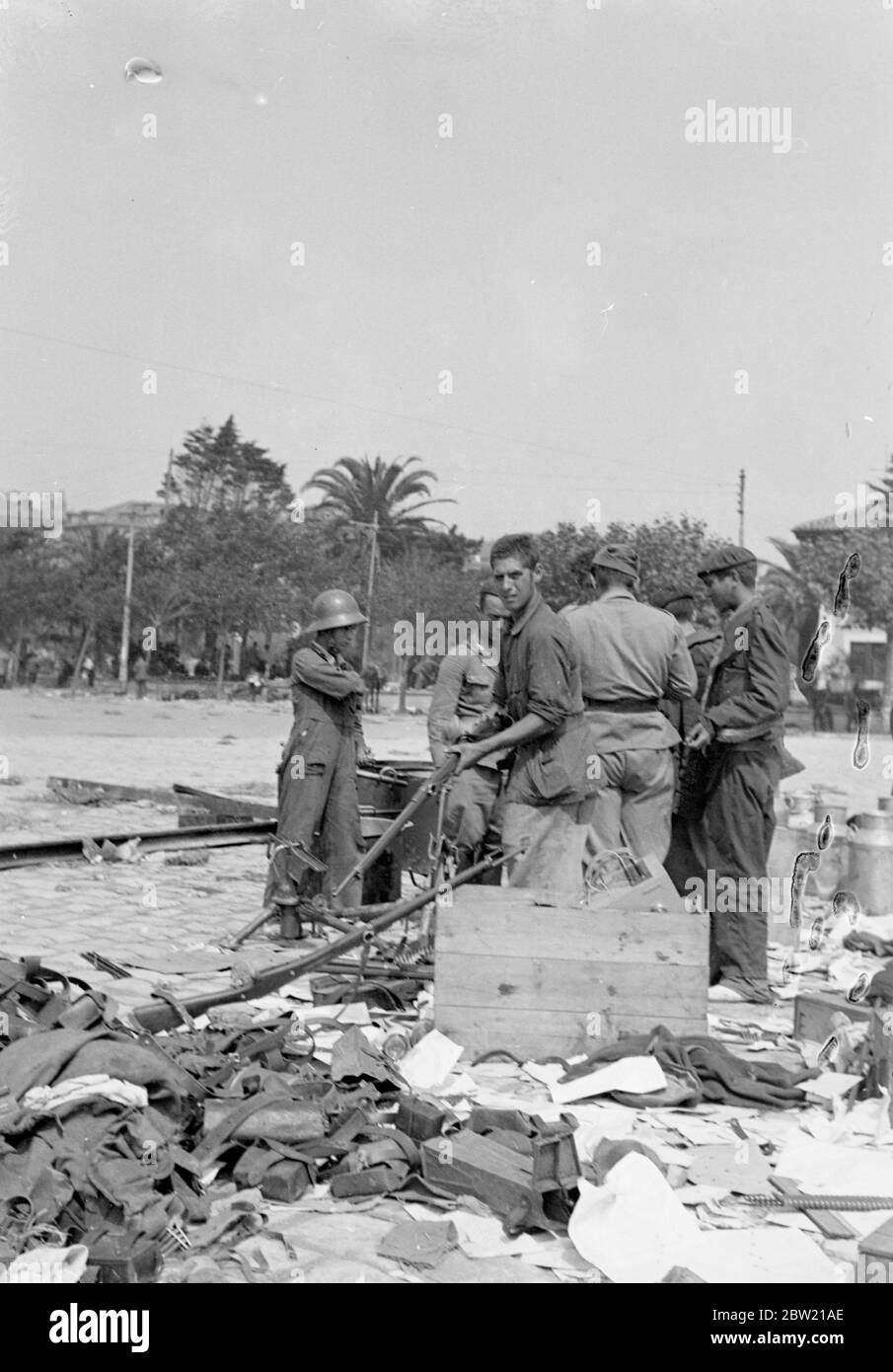 Large quantities of arms and ammunition captured from the defeated Government Troops are being collected by Spanish Nationalists in Santander, northern Spain, scene of their latest victory. It is estimated that about 50,000 loyalists were captured by general Franco's forces. 28 August 1937 Stock Photo