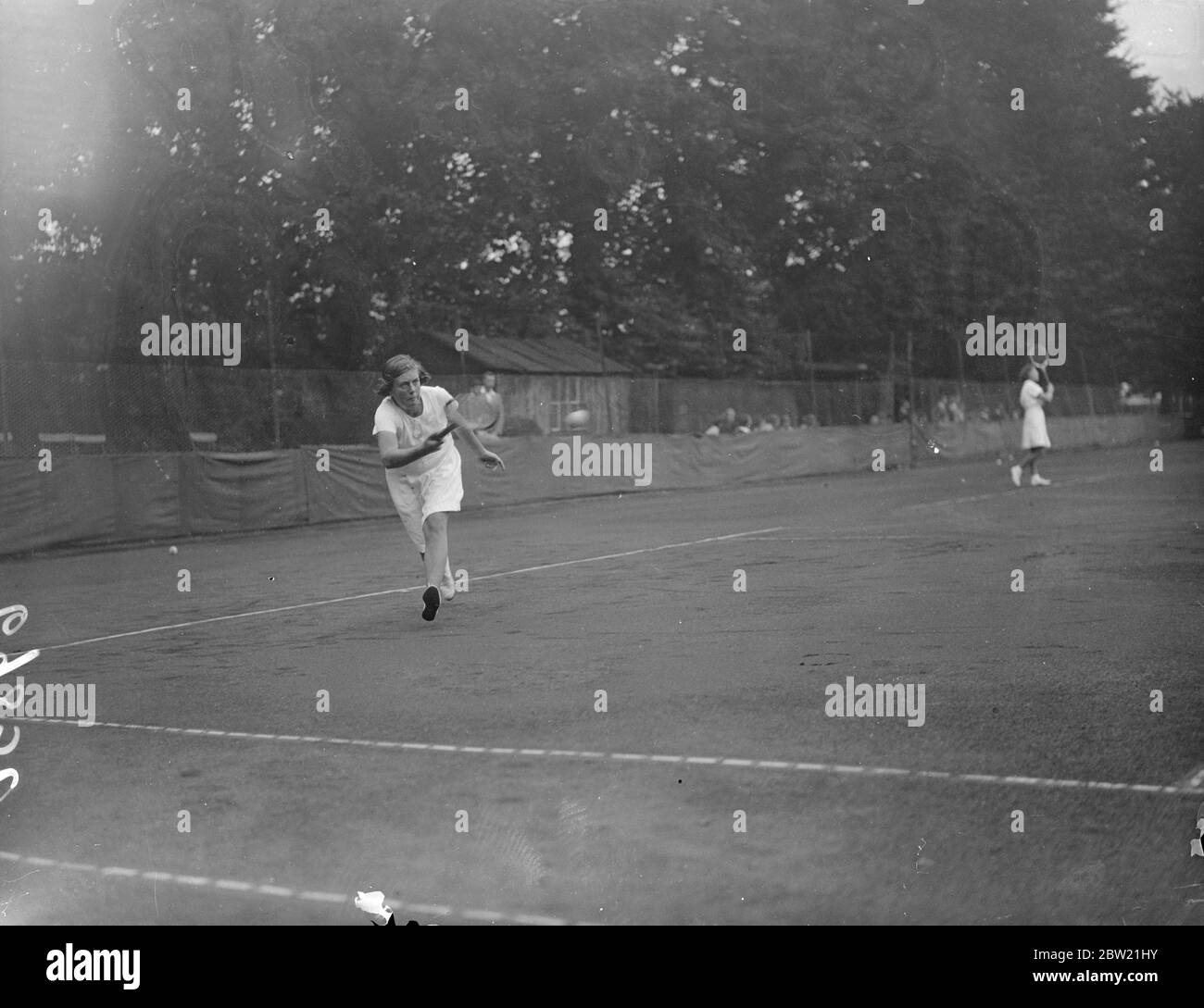 The Middlesex Junior Tennis Championships opened at the Herga Club, Harrow, London. Miss D. V. Copper in action. 30 August 1937 Stock Photo
