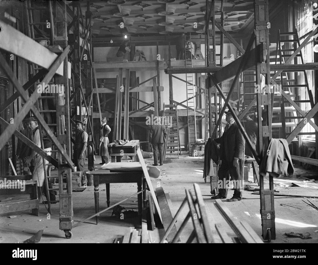 The dignified ministers dining room at the House of Commons turned into a Carpenters workshop while it is converted into new members making. Alterations which members voted Â£7500 before starting their three-month holiday. One innovation that will probably prove popular is the cold drinks bar, which will very likely serve as cocktail bar. 14 September 1937. Stock Photo