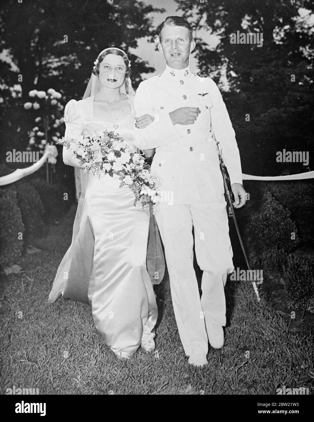 Duchess of Windsor's cousin weds Marine officer in Virginia. A cousin of the Duchess of Windsor, miss Frances Montague Hill, was married to captain Edward Colston Dyer of the United States Marines, at Wakefield Manor, near Flint Hill, near Virginia. Photo shows, the bride and groom after the ceremony at Wakefield Manor. The bride bears a distinct resemblance to the Duchess of Windsor, her cousin. 20 September 1937 Stock Photo